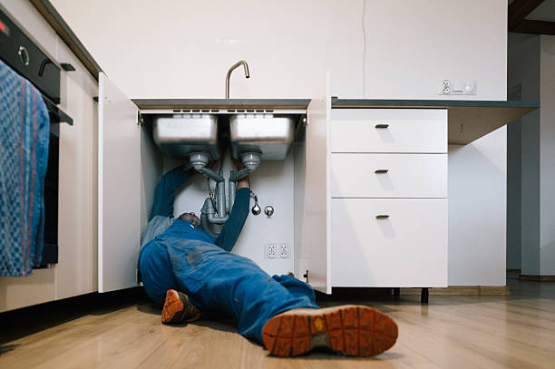 Professional Emergency Plumber technician working in Camden, IN